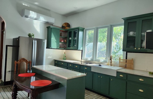 Arecibo Pueblo Casa | Built in 1942 and recently restored. Natural light and green lush vegetation.