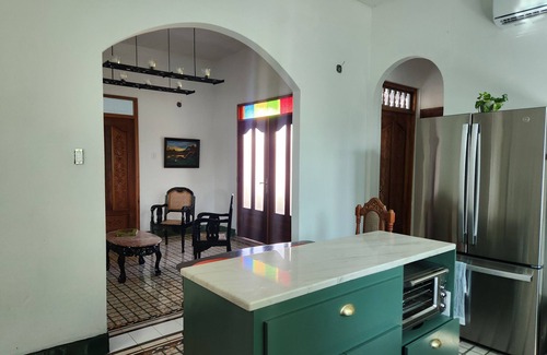 Arecibo Pueblo Casa | Built in 1942 and recently restored. Natural light and green lush vegetation.