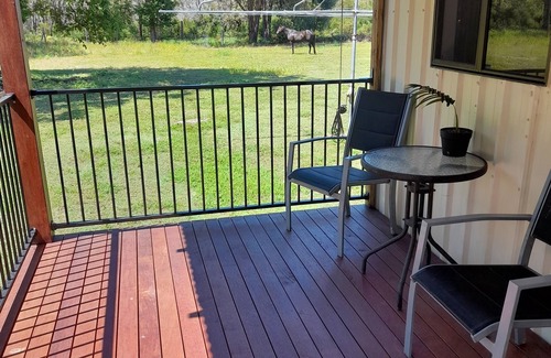 Coonarr Cabina | Bundaberg PETS A/C Small Rustic Cabin 1 bed kitchenette fridge bathroom BBQ deck