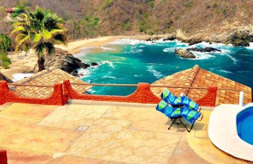 Puerto Ángel Villa | Bungalow frente a la playa estrene alberca nueva con increíble vista infinita al mar, 8 hermosas playas cercanas, terraza con cama de playa, espectacular vista al inmenso océano pacífico, 2 kayack disponibles, nómadas digitales Starlink WiFi 224 mbps