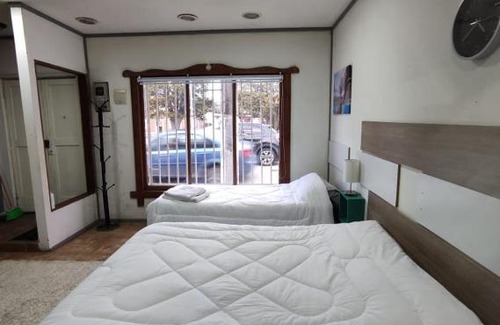 Punta Arenas Apartamento | Cabaña de John Wine
