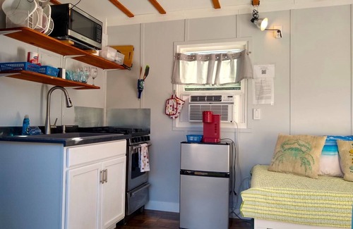 Colonial Beach Cabaña | Cabernet Cottage on Water at Monroe Bay Winery, tiny container cottage