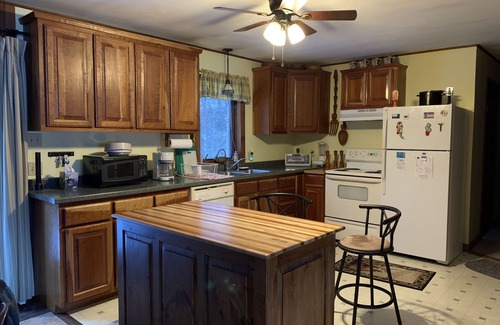 Newport Cabina | Cabin is nestled near the Sugar River in a country setting next to a open field.