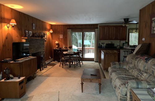 Newport Cabina | Cabin is nestled near the Sugar River in a country setting next to a open field.