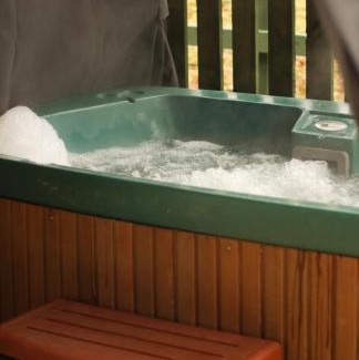 Hendrerwydd Casa | Caer Fedwen Barns Dyffryn Cottage King bed self catering with Hot Tub