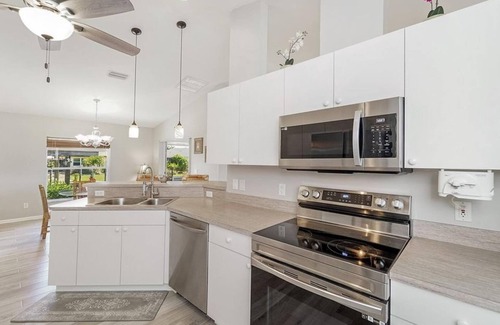 Lochmoor Waterway Estates Casa | Calling all boaters and fishermen! Canal front home with 10k lb boat lift!