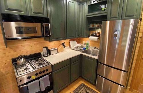 Pinecrest Cabina | Camp Leland · Dog Friendly 4-Season Cabin + Garage, meadow view