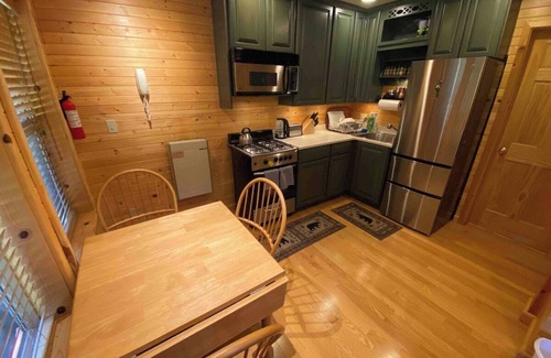 Pinecrest Cabina | Camp Leland · Dog Friendly 4-Season Cabin + Garage, meadow view