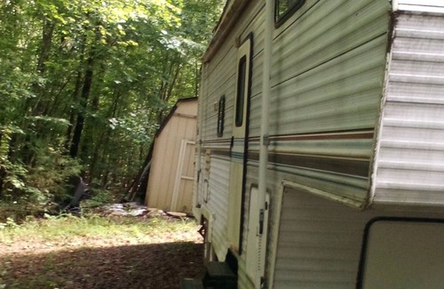 Wake Forest Casa | Camper off home in wooded property small creek.
