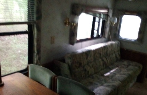 Wake Forest Casa | Camper off home in wooded property small creek.