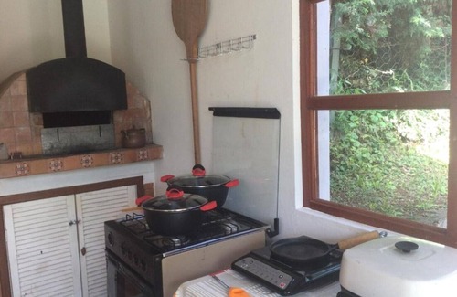 Vila Natal Chalet De Esquí | Campos do Jordão - Suite with living room, on the mountain overlooking the woods