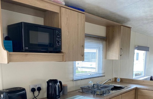 Rhyl Cabina | Caravan With Decking at Lyons Robinhood