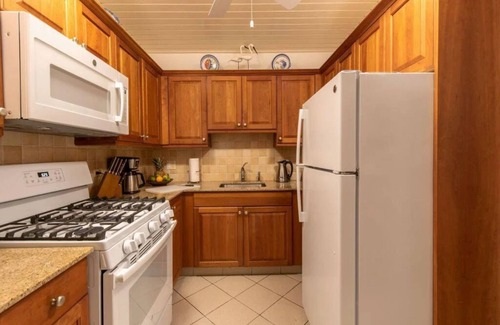 West End Village Hotel | Caribbean Getaway | Room w/ Full Kitchen & Patio | Steps Away from the Beach