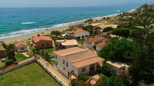Urbanizacion Costabella Casa | Casa Azura - Beachfront with Private Terrace, Garden, BBQ, and Garage in Marbella