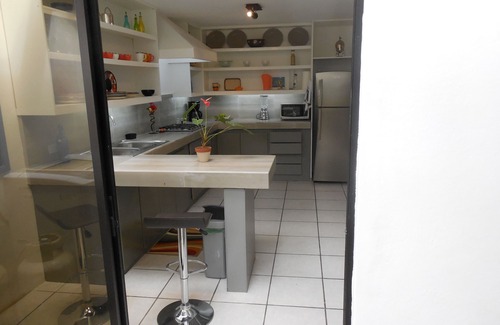 Cuenca Apartamento | Casa Bella Mia. ¡Este acogedor y espacioso piso con exuberante jardín te espera!