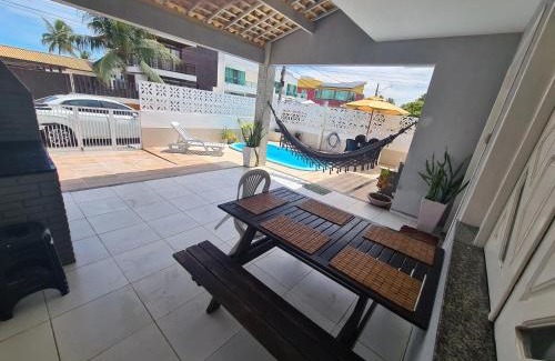 Mosqueiro Casa | Casa cinza em frente à praia em condominio