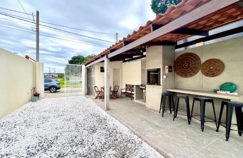 Guaratuba Casa | Casa com piscina , ar condicionado e churrasqueira no balneário Eliana