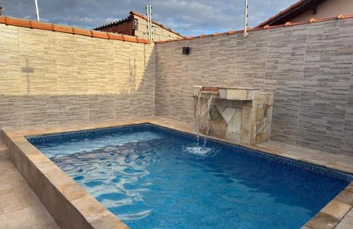 Mongagua Casa | Casa com piscina garagem para 4 carros