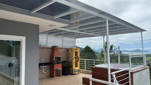 Jardim Capricornio Casa | Casa com spa em Caraguatatuba