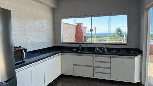 Jardim Capricornio Casa | Casa com spa em Caraguatatuba
