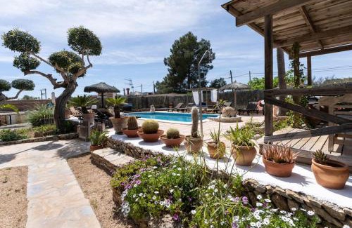 Santa Eulalia del Río Casa | Casa con piscina, jardín y juegos exteriores
