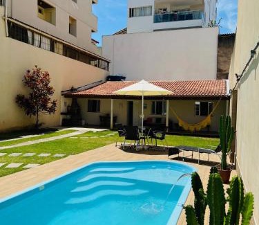 Praia do Morro Apartamento | Casa de Praia com Piscina, quintal, lazer e churrasco, 3 quartos com ar condicionado, sendo 2 suites para sua familia!