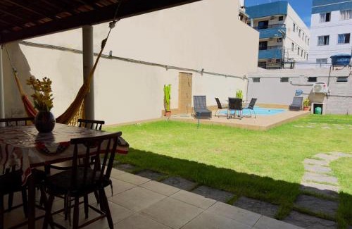 Praia do Morro Apartamento | Casa de Praia com Piscina, quintal, lazer e churrasco, 3 quartos com ar condicionado, sendo 2 suites para sua familia!