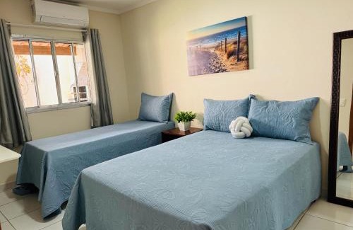 Praia do Morro Apartamento | Casa de Praia com Piscina, quintal, lazer e churrasco, 3 quartos com ar condicionado, sendo 2 suites para sua familia!