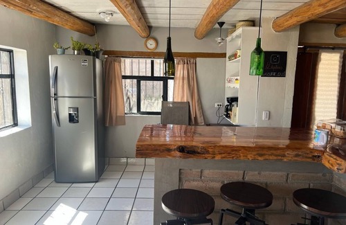 Creel Cabina | Casa MiRó Creel, a cozy place with an indoor fireplace.