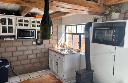 Creel Cabina | Casa MiRó Creel, a cozy place with an indoor fireplace.