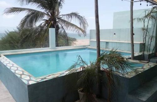 Puerto Yucalpetén Casa | Casa Rosa 2 bedroom beach fronted home with private pool