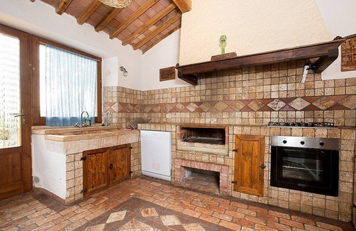 Castiglione d'Orcia Casa | Casa Salvia E: un apartamento en el estilo característico de la campiña toscana.