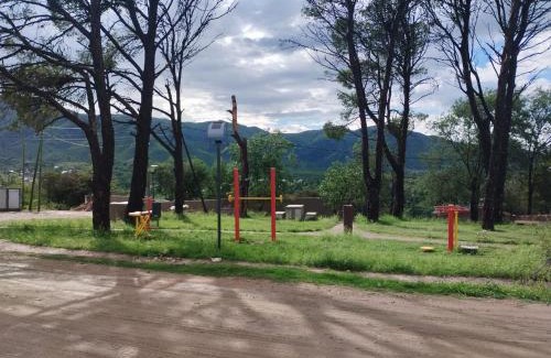 Huerta Grande Casa | Casas HG-Desayuno sencillo entregado al check in-Pileta climatizada en predio a 2 kilómetros-Acepta mascotas bajo petición-Cochera para 1 auto