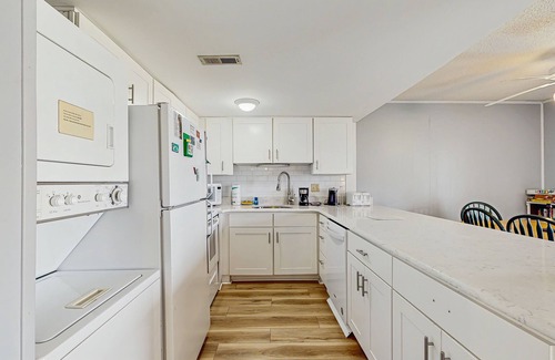 Ocean View Condominio | Cedar Shores condo with shared pool, private balcony, WiFi, & stunning bay views