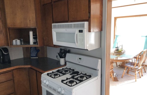 Tawas City Casa | Central located. Includes finished 2 car garage! 1 minute from beach!