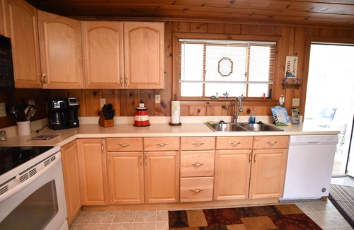 Prudenville Cabaña | Centrally located, four season retreat w/firepit and lakeview.