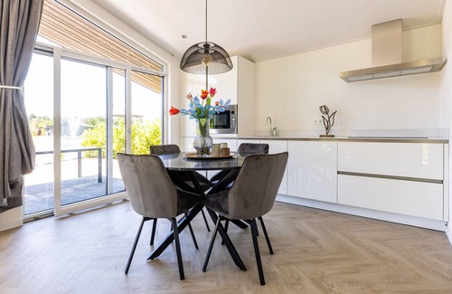 Municipality of Veldhoven Chalet De Esquí | Chalet by Pond in Holiday Park