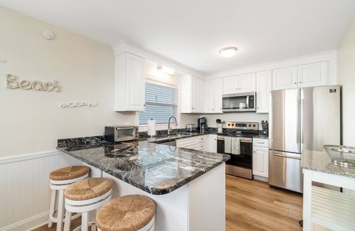 Emerald Isle Cabaña | Charming 5-bedroom oceanfront duplex with wonderful views