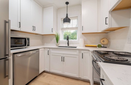 Blacksburg Casa | Charming cottage entrance with cozy curb appeal, nestled in a peaceful and green setting.