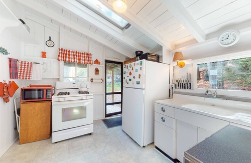 West Alton Cabaña | Charming dog-friendly lakefront cottage with private dock & community beach