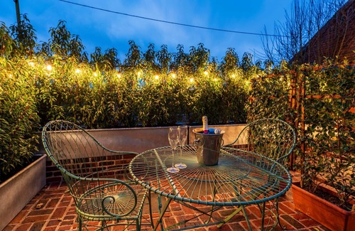 Ipswich Cabaña | Charming medieval cottage courtyard garden and wood burner in serene Kersey