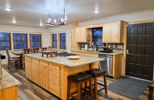 Rio Vista Estates Casa | Charming riverfront cabin with hot tub, fireplace, and stunning outdoor views