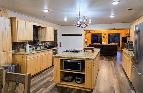 Rio Vista Estates Casa | Charming riverfront cabin with hot tub, fireplace, and stunning outdoor views