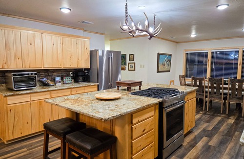 Rio Vista Estates Casa | Charming riverfront cabin with hot tub, fireplace, and stunning outdoor views