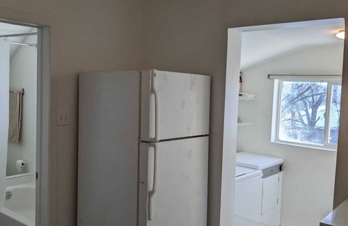 Winnipeg Casa | Charming small 2-bedroom unit in brilliant Winnipeg with AC, WiFi and trampoline