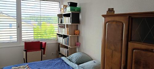 Courtepin Casa | Chez Elsa et Agou - chambre confortable chez l'habitant