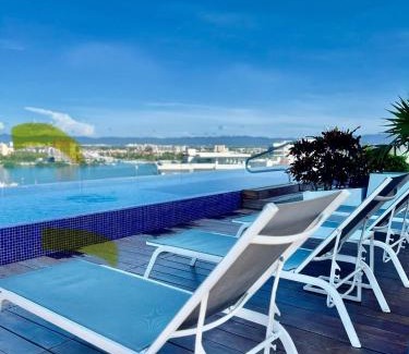 Zona hotelera del norte Apartamento | Chic 1BR 1BA Zoho Skies condo with rooftop pool stunning views