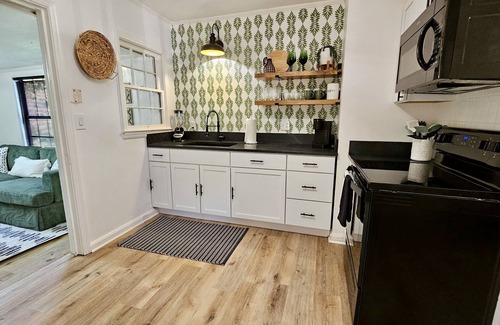 Valdosta Cabaña | Chic Central Cottage- Wood Floors, Fireplace, Game Room & Firepit- Pet Friendly