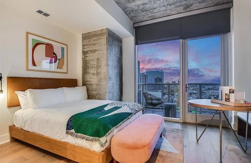 Rainey Street Historic District Hotel | Chic tower condo with city views in downtown Austin Texas. Pets Welcome