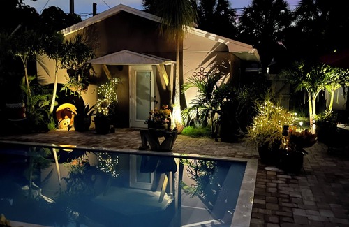 Parrot Cove Cabaña | Chill on the patio overlooking the pool & lush gardens & grill your dinner!